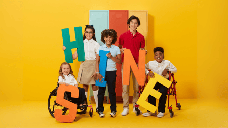 Kids wearing French Toast holding letters that spell the word shine